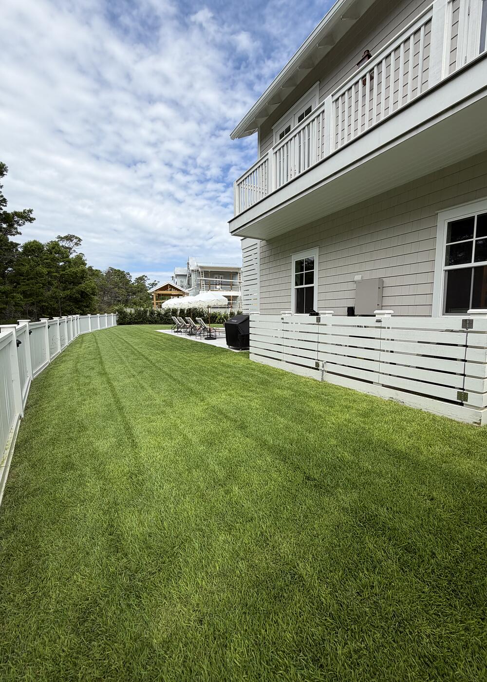 Mowing stripes running clean along a fence line